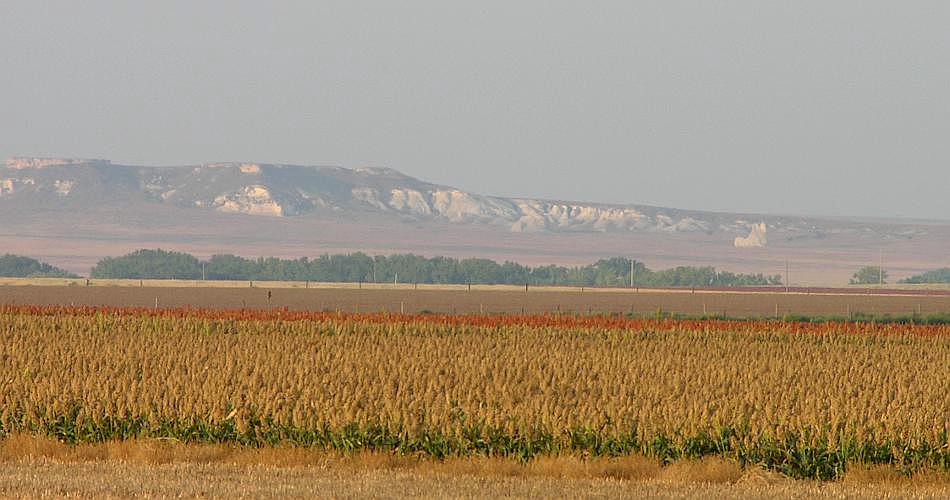 Castle Rock Badlands in distance across fields