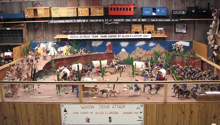 Wagon Train Attack wood carving by Allen D. Larson