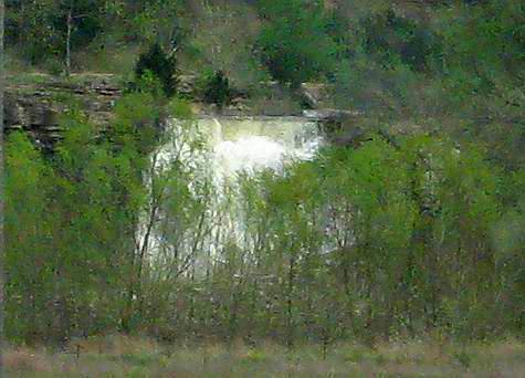 Bourbon Lake Falls through the trees from the distance