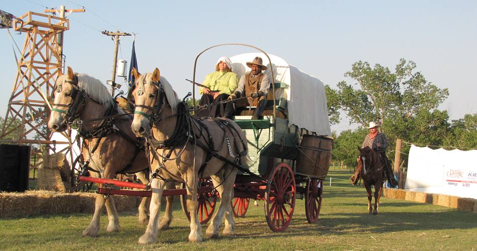 Conestoga wagon crossing the stage at the historical pageant