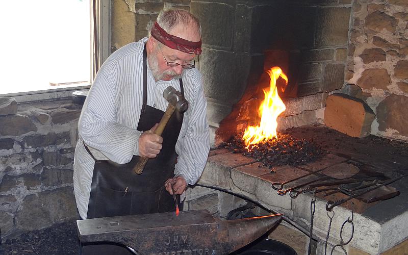 Fort Larned blacksmith at work