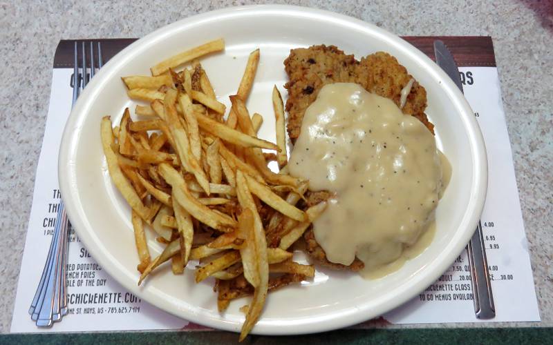 chicken fried steak with mashed potatoes and corn