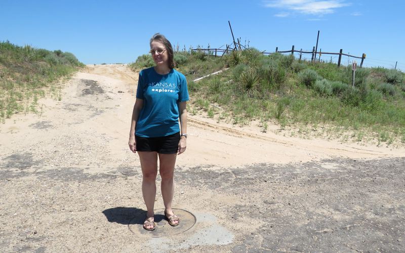 standing on the Tristate Marker