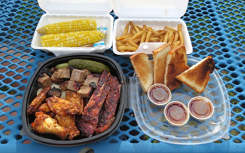 Shack platter with wings, burnt ends and 4 pork ribs with fries and corn on the cob