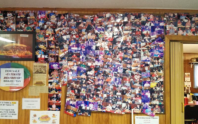 Papa Bob's Wall of Fame photos of customers who ate the Ultimate Destroyer