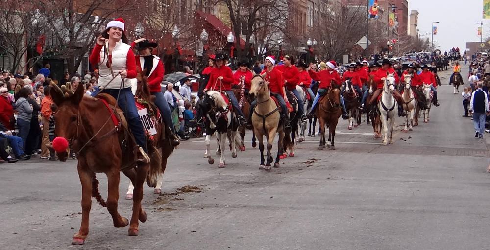 Horse back riders in the Lawrence Christmas Parade