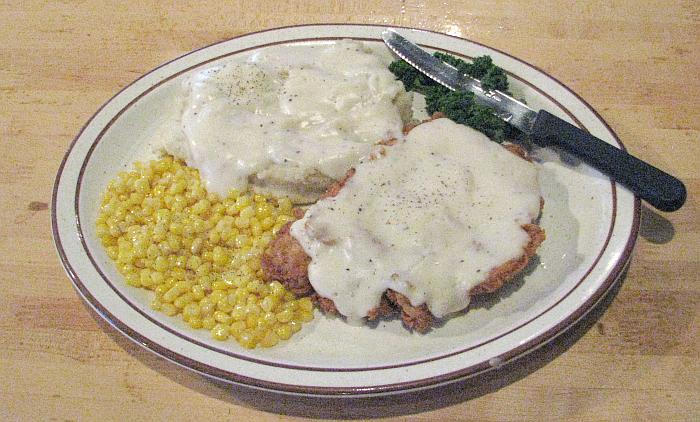 country fried tenderloin with gravy, real mashed potatoes and corn
