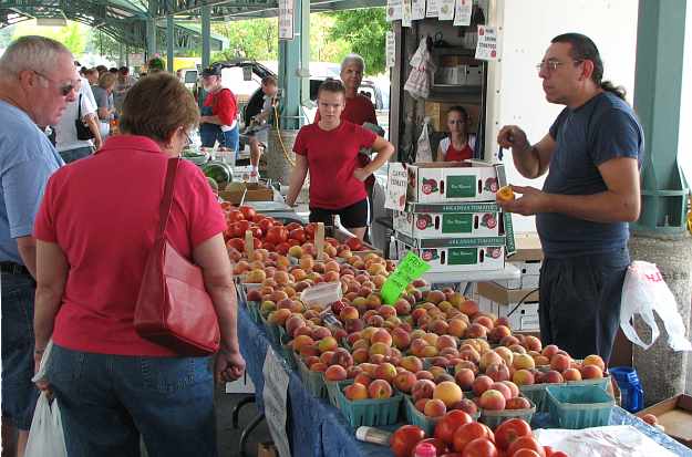 Produce seller at Overland Park Farmers Market