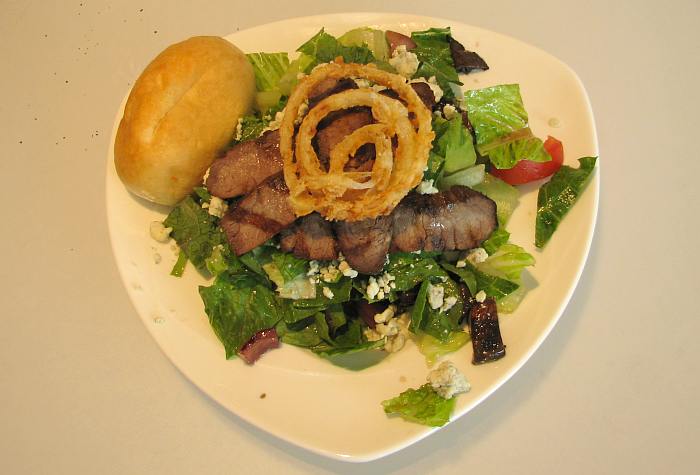 Caf� Steak (grilled flank steak with romaine lettuce, roasted red onions, portabella  mushrooms, roma tomatoes, gorgonzola cheese and sherry balsamic vinaigrette)