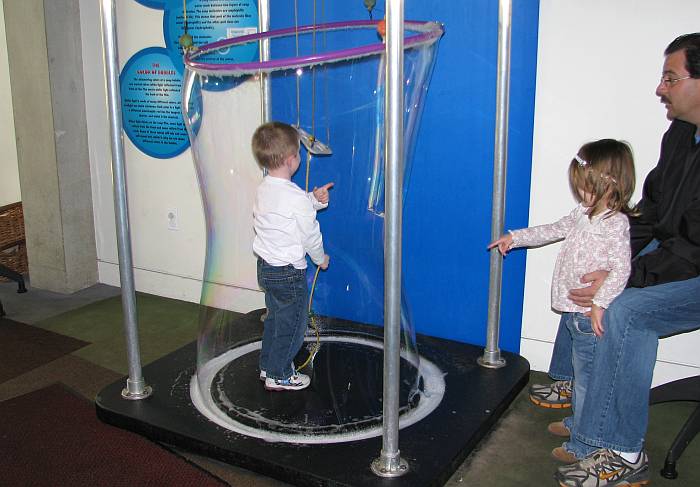 Child in giant soap bubble